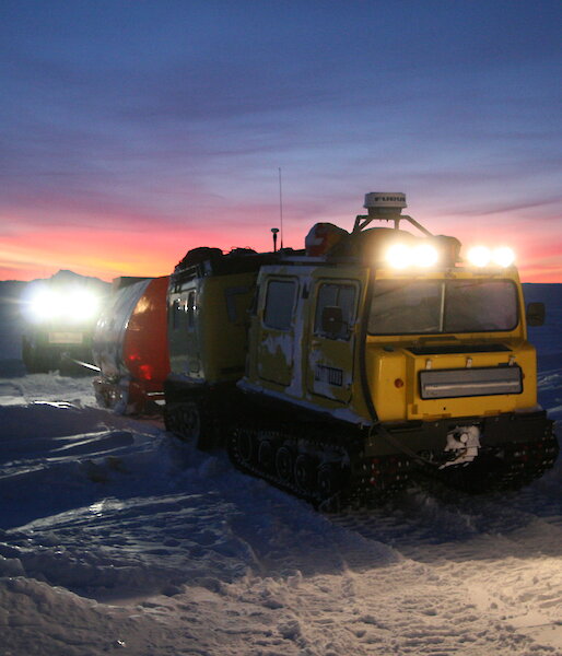 Mawson station Hagglund heading off in the morning twilight