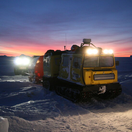 Mawson station Hagglund heading off in the morning twilight