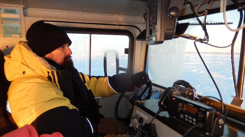 Expeditioner driving a hagglund, photo taken from inside the hagg