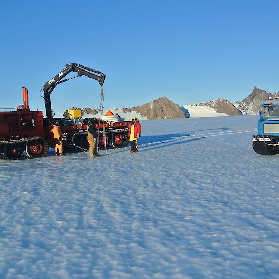 Poles being removed with the North Masson Ranges in the background