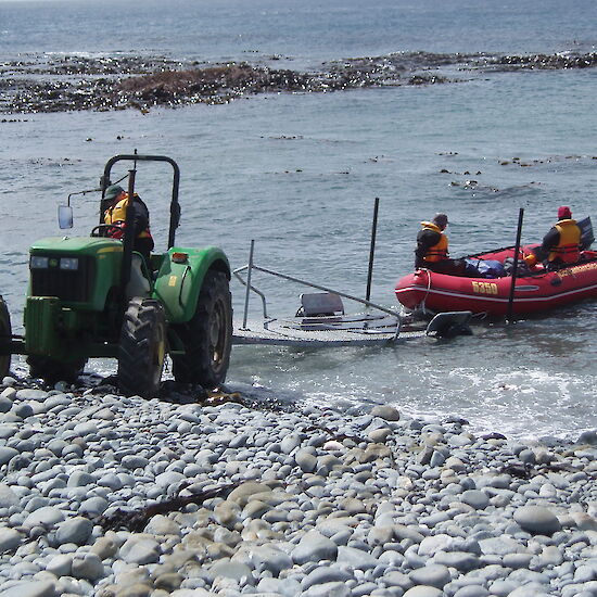 Launching a Zodiac IRB by tractor