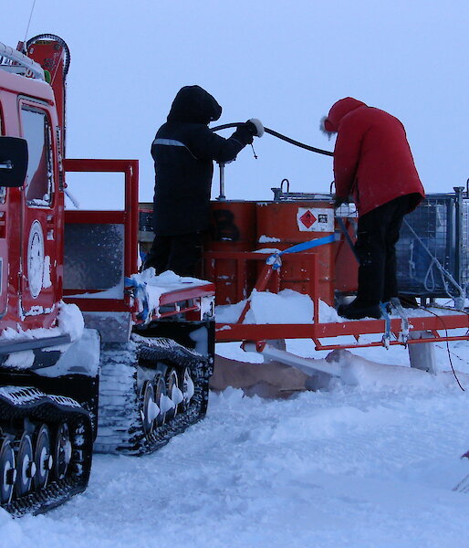 Expeditioners refuelling at Law Dome
