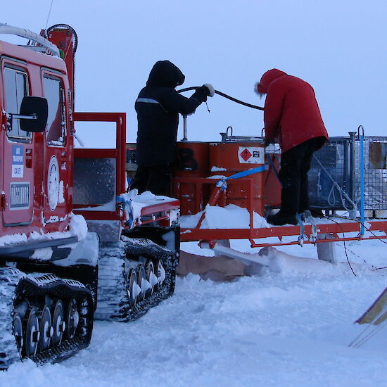 Expeditioners refuelling at Law Dome