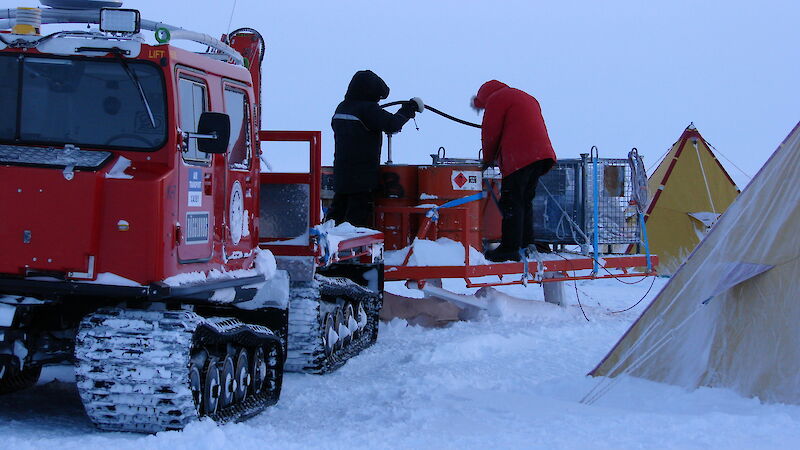 Expeditioners refuelling at Law Dome