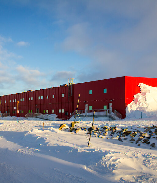 Large oblong bright red two story building