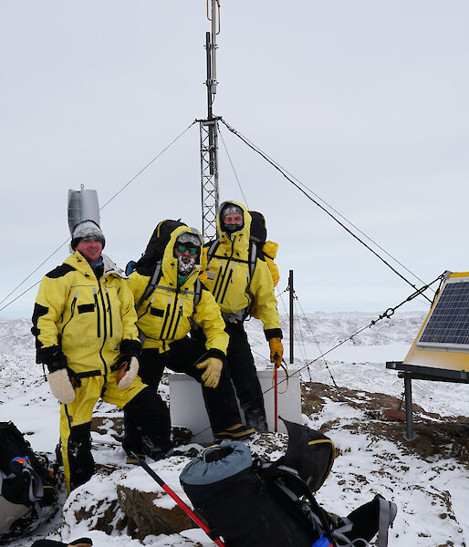 Group of expeditioners standing near VHF repeater