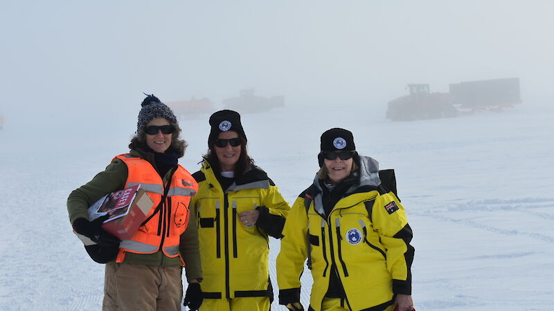 Three expeditioners at ice runway