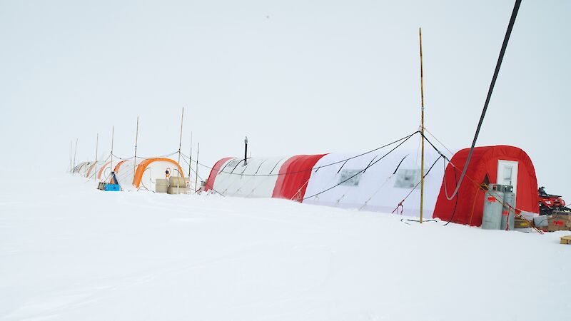 Long dome shaped base camp tents in the Aurora Basin North icescape