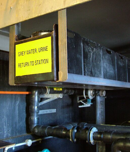 Tanks and pipes in a shed.