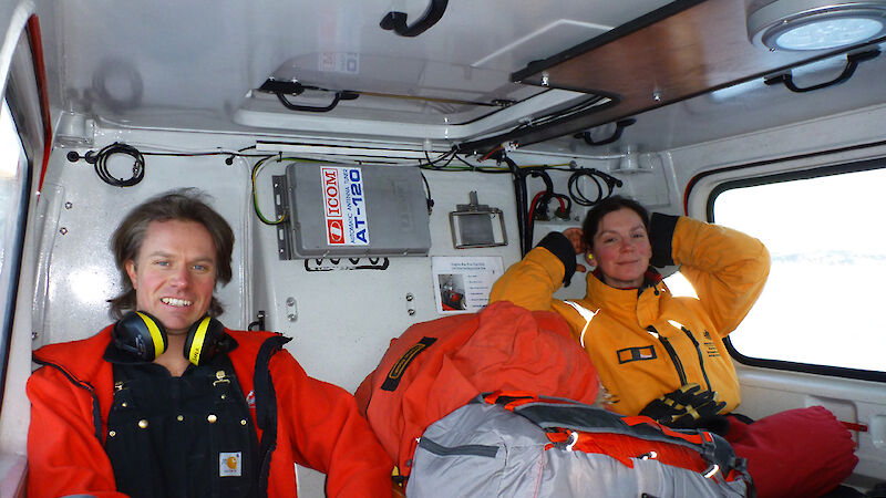 Two expeditioners sitting in the back of the Hagg.