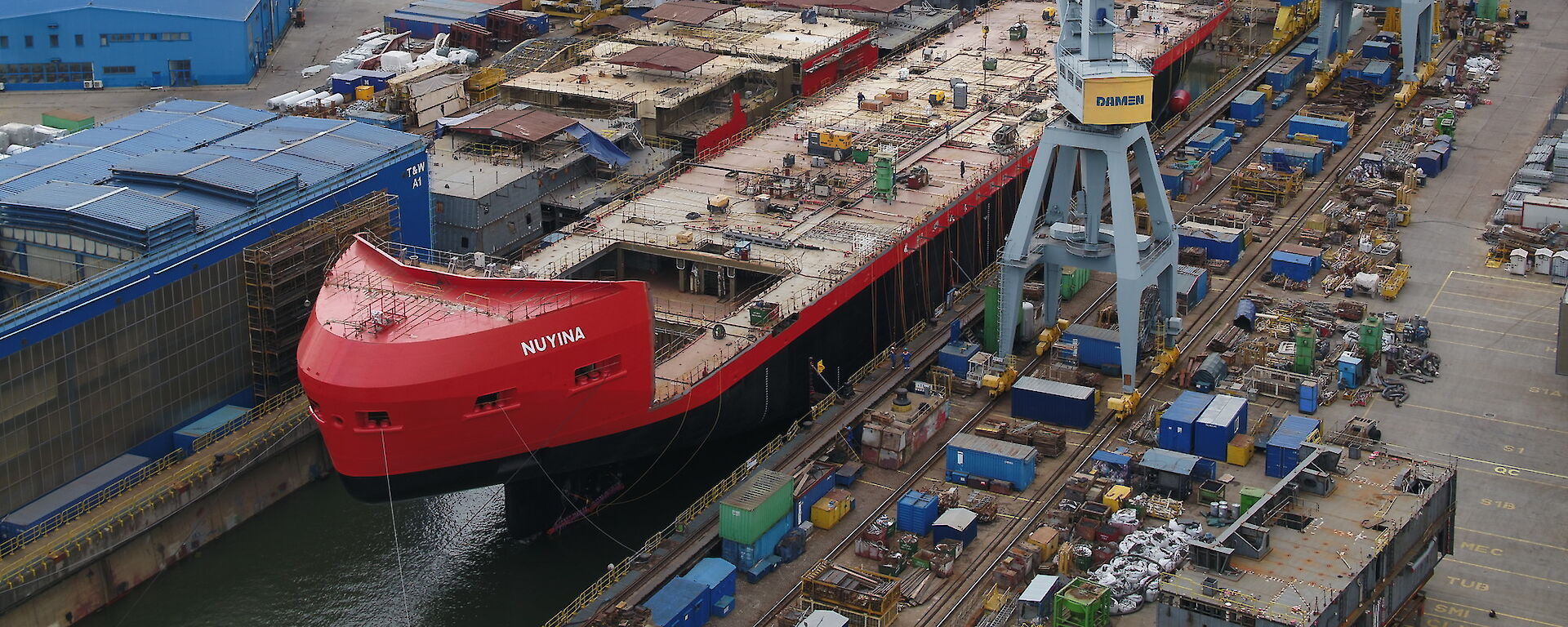 Ship under construction floating in dry dock