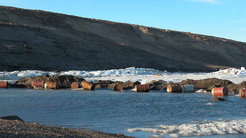 Rust-coloured drums on the snow.