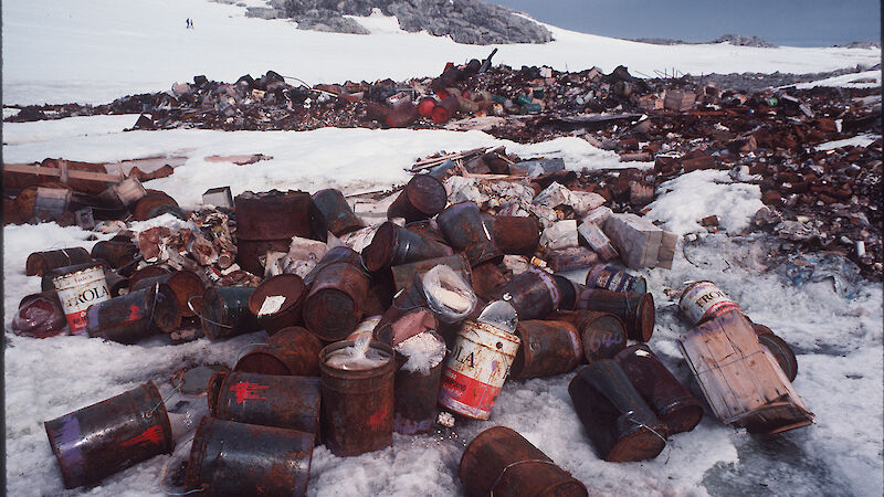 Tins and packing crates on tip site