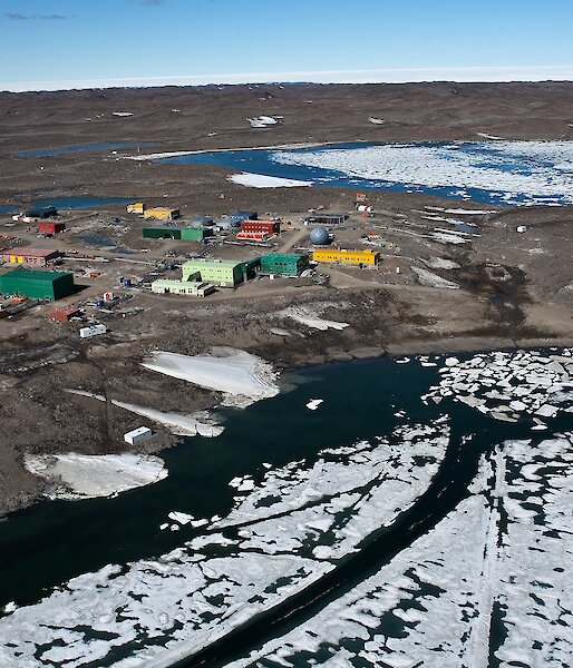 A collection of colourful buildings, viewed from the air.