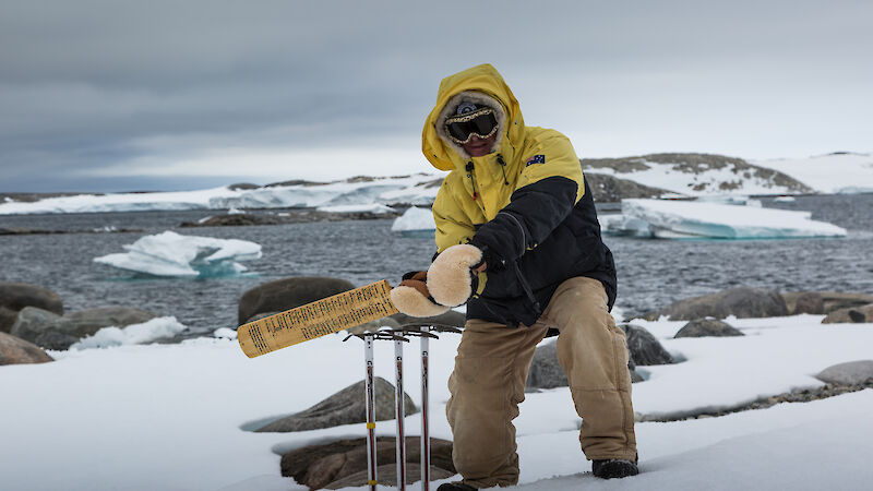 Expeditioner demonstrating the signed cricket bat in use