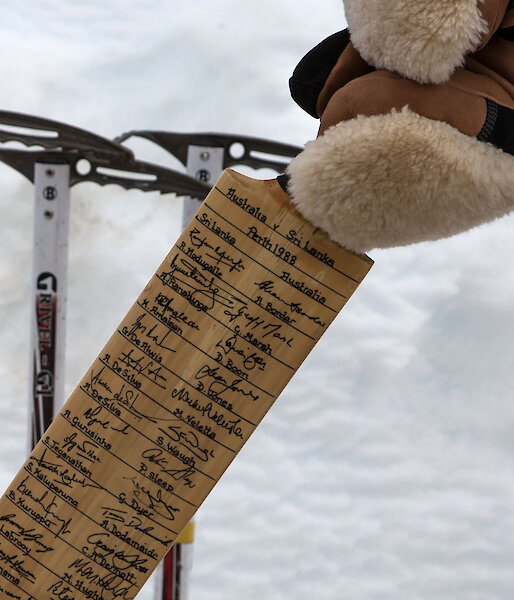 Close-up of signed cricket bat
