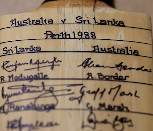 Close-up of the top of the signed cricket bat