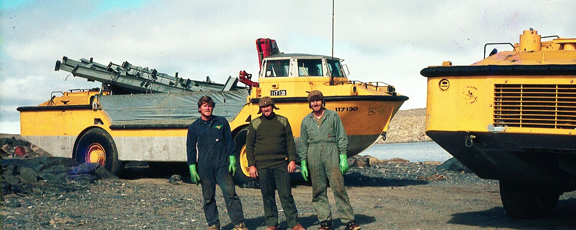 Three men with an amphibious vehicle