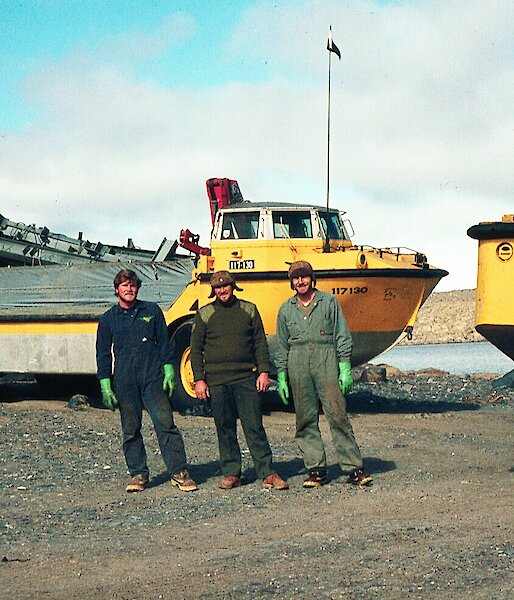 Three men with an amphibious vehicle
