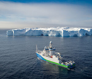 RV Investigator with iceberg