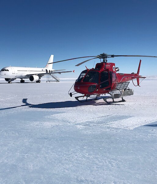 A helicopter and a jet aircraft on an ice runway