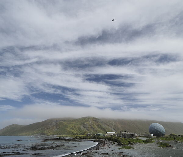 The Dash-8 aircraft flies over Macquarie Island’s isthmus as it conducts a Laser Airborne Depth Sounder (LADS) survey.