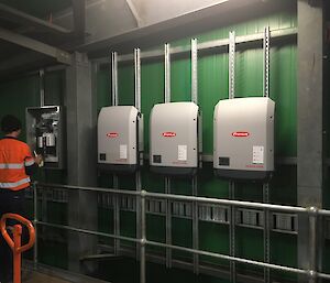 The three inverters that will convert DC power into 240V AC power.