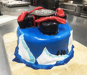 A drone tops off an iceberg and penguin cake