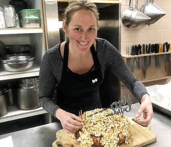 Casey station chef, Jordan Smith, puts the finishing touches on a cake in the kitchen