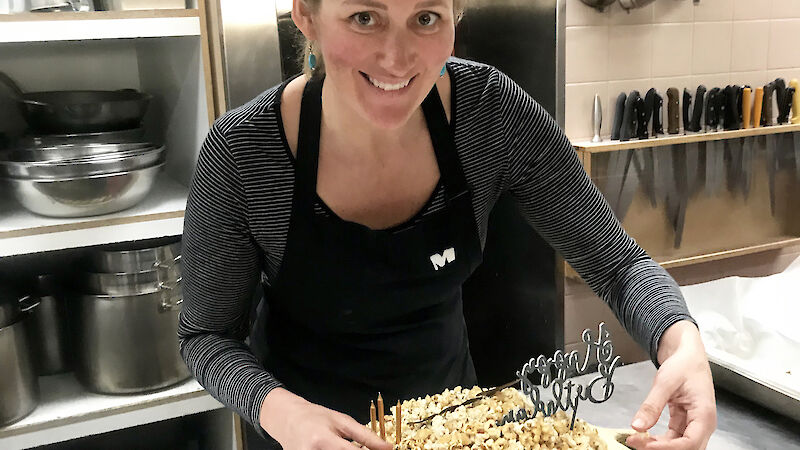 Casey station chef, Jordan Smith, puts the finishing touches on a cake in the kitchen