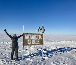 Jordan Smith at the Antarctic Circle sign