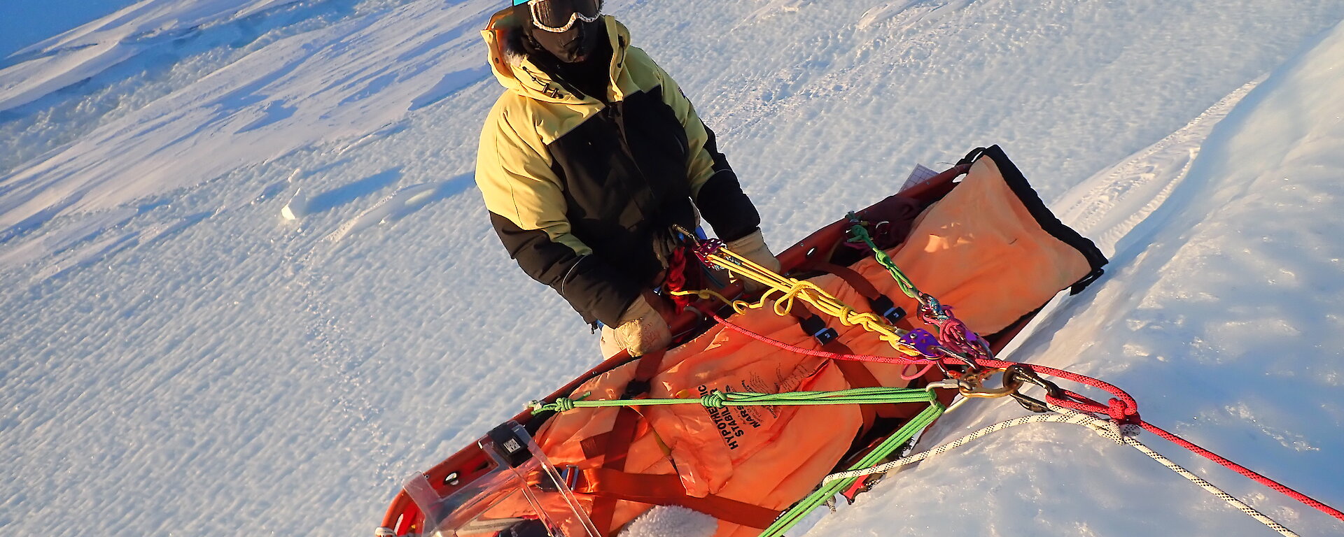 Stretcher on ice cliff