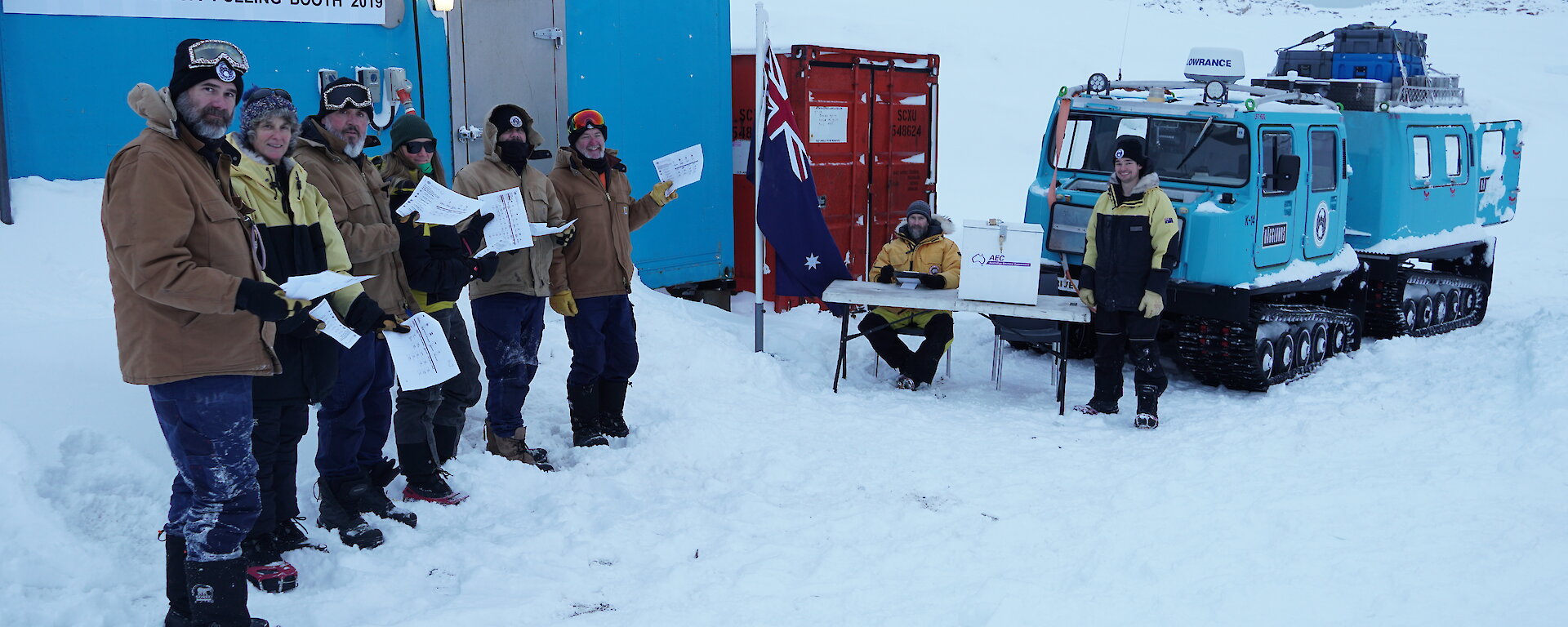 Expeditioners at the polling station on the wharf at Casey research station