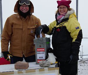 Two people with ballot box