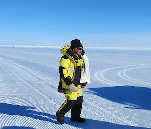 Former Australian Prime Minister Bob Hawke standing on an Antarctic ice runway