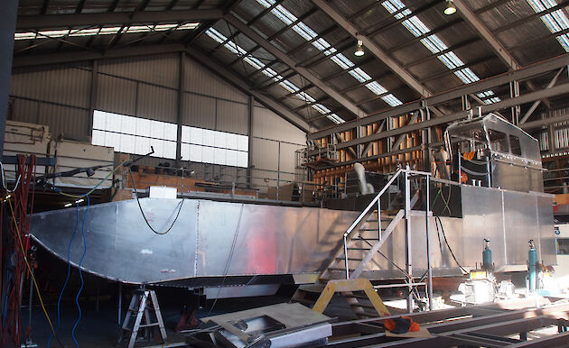 The second landing barge under construction inside a shed at Taylor Bros.