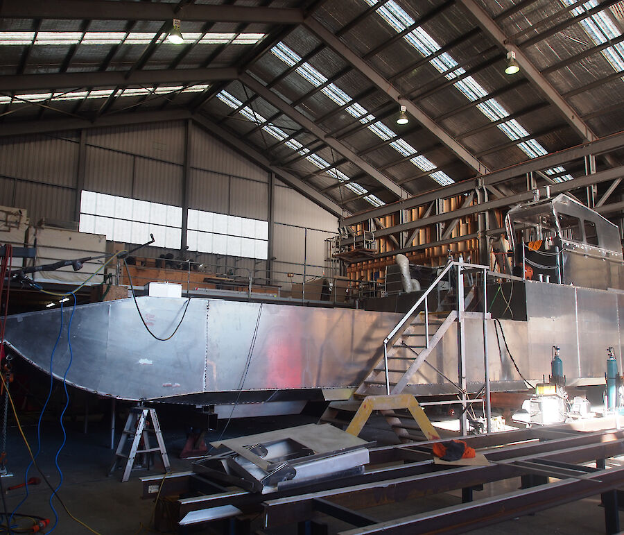 The second landing barge under construction inside a shed at Taylor Bros.