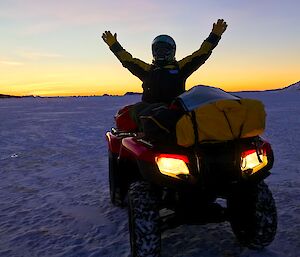 Expeditioner on quad bike at last sunset