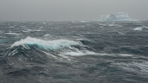 Southern Ocean and iceberg on grey stormy day