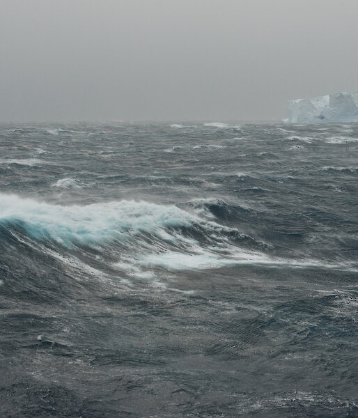Southern Ocean and iceberg on grey stormy day