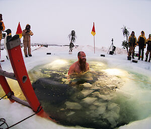 Plumber Dan Gough plunges into the icy pool as part of midwinter celebrations at Australia’s Davis research station