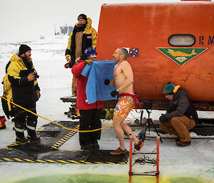Time to warm up! Davis station leader, Simon Goninon, dives for the towel after his icy dip