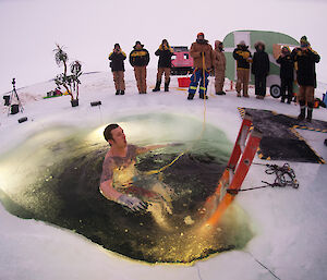 Here we go! Davis research station electrician, Joe Burton, plunging into ice hole