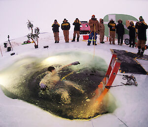 Here we go! Davis research station electrician, Joe Burton, plunging into ice hole