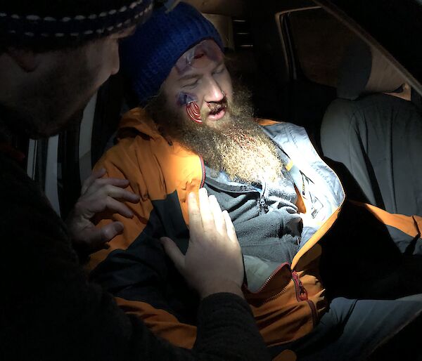 Doctors attend to a simulated car crash victim in a scenario at Arm River in Tasmania