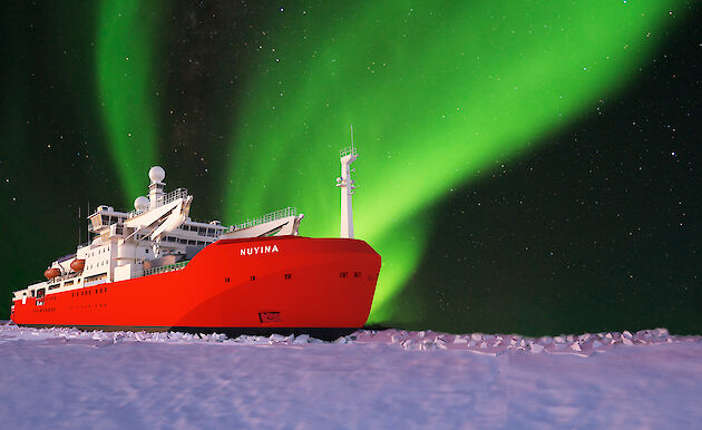 graphic of icebreaker in ice with aurora