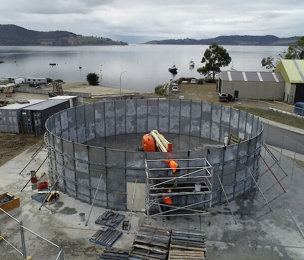 Photo of grey round partially constructed water tank