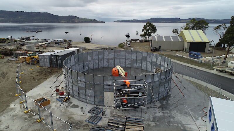 Photo of grey round partially constructed water tank