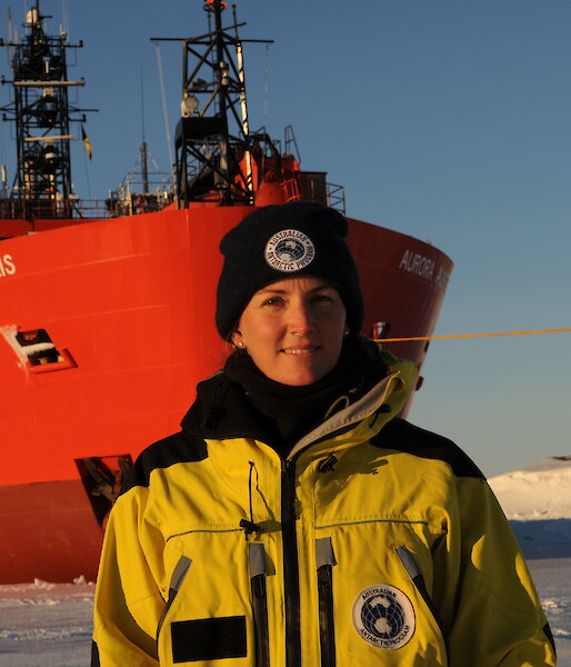 Sarah during her trip to Davis research station in 2017 standing on the sea ice at the bow of the Aurora Australis.