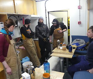 people inside a crammed shipping container